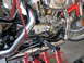 2004 Harley-Davidson Sportster Custom - Close-up of a motorcycle's engine and exhaust system, supported by a red stand.