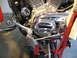 2004 Harley-Davidson Sportster Custom - Close-up view of a motorcycle's engine and control components, showing intricate mechanical details.