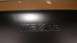 1986 Mazda RX-7 - The embossed Mazda logo is visible on a dark, textured surface. A website watermark is present at the bottom.
