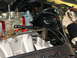 1978 Ford Ranchero - This image shows a detailed view of a vehicle's engine components, including the carburetor and intake manifold.