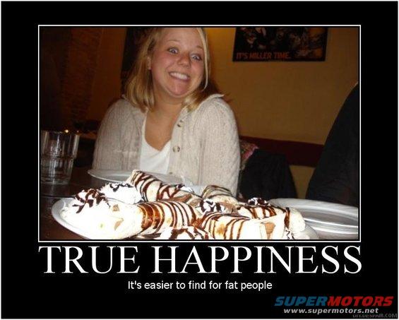 Woman with wide eyes and a large smile looks at a plate piled high with desserts topped with whipped cream and chocolate syrup