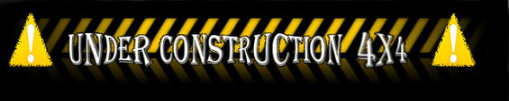 Sign with yellow triangles and black and yellow stripes reads 'UNDER CONSTRUCTION 4X4'