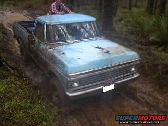 Givin all she's got to get up one slick rutted hill.