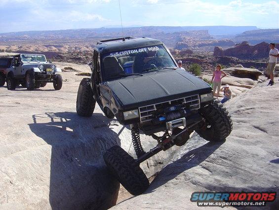 1986 Ford Bronco II on rocks, with another Jeep in background