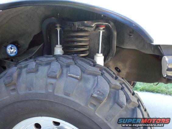 Note location of oval hole just right of front shock