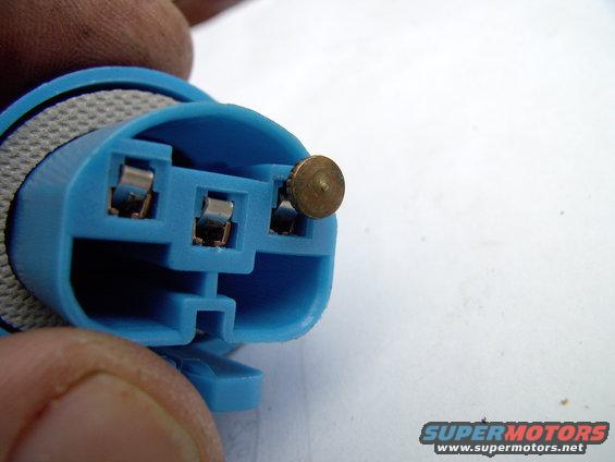 Just stick a pin or nail into the top of each terminal and you'll depress the tang so you can just pull the wire, with terminal, out the back of the connector.