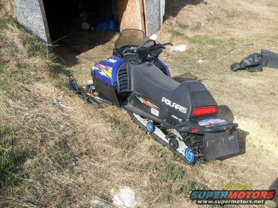 Blue and black Polaris snowmobile with '700' badge and 'Polaris' text