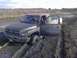 1996 Dodge 1500 - This Dodge 1500 is deeply stuck in thick mud, with its doors open, suggesting a difficult off-road situation.
