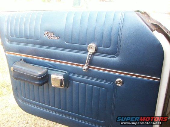 door-panel.jpg This would be your sight when you get out of the car from the driver's seat.  This window doesn't roll down, it's jammed in place.  Probably because the remote mirror cable is in the way, as you can see it isn't where it should be.  The armrest soft part needs redone as well but the panel is in good overall shape and will clean up nice.