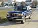 1996 Ford Bronco - 1996 Ford Bronco parked on a suburban driveway during the day.