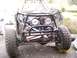 1984 Ford Bronco - Front view of a custom off-road buggy chassis, showing the engine and suspension components.