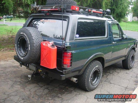 1993 Ford Bronco with spare tire on rear, jerry can, and roof rack