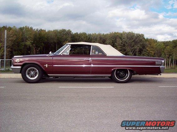 Maroon 1963 Ford Galaxie convertible parked on the side of the road