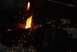 1996 Ford Bronco - A welding torch creates a bright flame and sparks while working on a dark metal component, likely a vehicle part.