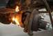 1996 Ford Bronco - Cutting a rusty suspension part with a torch.