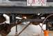 1996 Ford Bronco - Working on the undercarriage of a vehicle with a torch, license plate CJR-550 is visible.