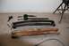 1996 Ford Bronco - Leaf springs and suspension parts laid out on a garage floor.