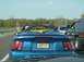 2001 Ford Mustang - A blue 2001 Ford Mustang convertible, identified as a Saleen model, is seen in traffic.