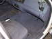 2000 Ford Crown Victoria - The interior of a 2000 Ford Crown Victoria shows the driver's seat, dashboard, and floor with visible wear and loose wiring.