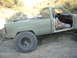 1985 Toyota 4Runner - This modified pickup truck is navigating a challenging rocky path off-road.