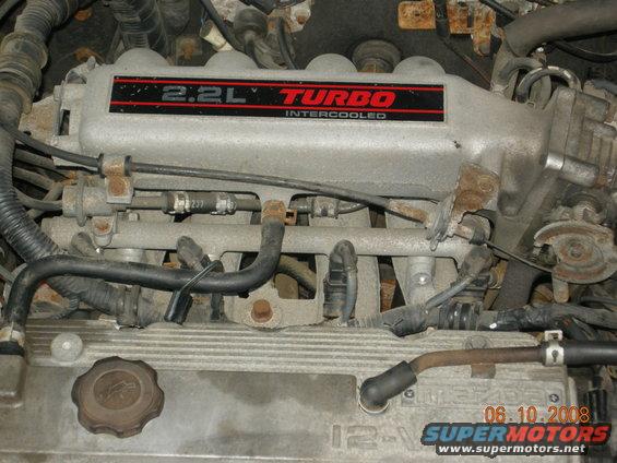 Close-up of a 2.2L Turbo intercooled engine intake manifold with hoses and wires