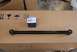 1996 Ford Bronco - A NAPA Auto Parts box sits next to a vehicle suspension arm on a cardboard box.