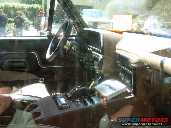 Interior shot of a truck's dashboard and center console, with a 'Lowrance' device on the dash