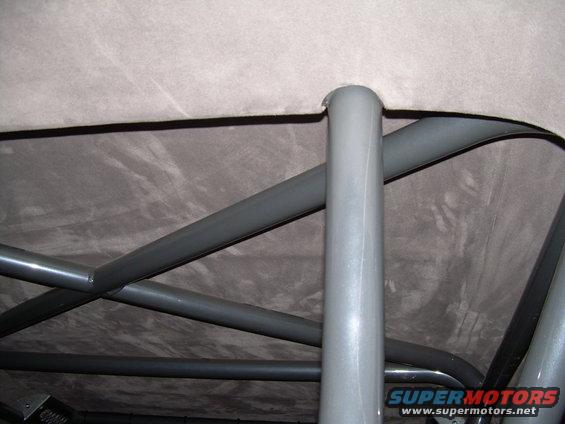 interior view of a roll cage with gray tubing and a gray headliner