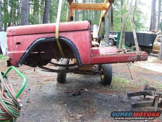 1967 Ford Bronco body lifted by crane, side view