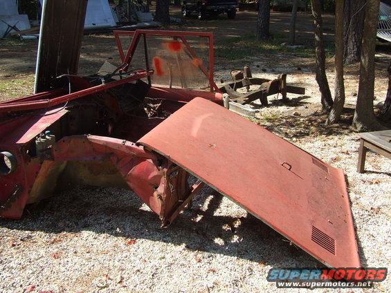 Red car hood and fender assembly, damaged, with visible Supermotors.net logo