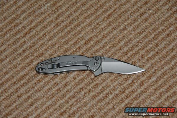 Kershaw folding knife with clip, text reads 1650, C:\KERSHAW\1650.TXT, Pat. No. 4,501,544