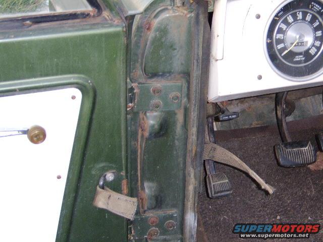 Green interior door hinge and dashboard with speedometer reading 50 mph