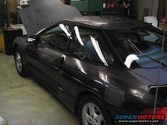 Dark 1993 Ford Probe 3q-front view with hood open