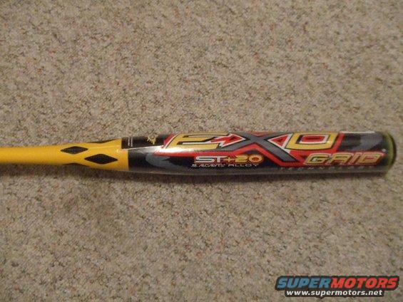 Yellow and black baseball bat with red and silver graphics, labeled 'EXO GRID ST+20 BLACK ALLOY'