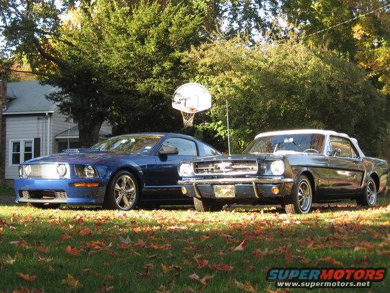 1965 Ford Mustang convertible next to a blue modern Mustang