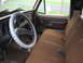 1978 Ford F-250 - Interior view of a 1978 Ford F-250, showing the bench seat, dashboard, and steering wheel.