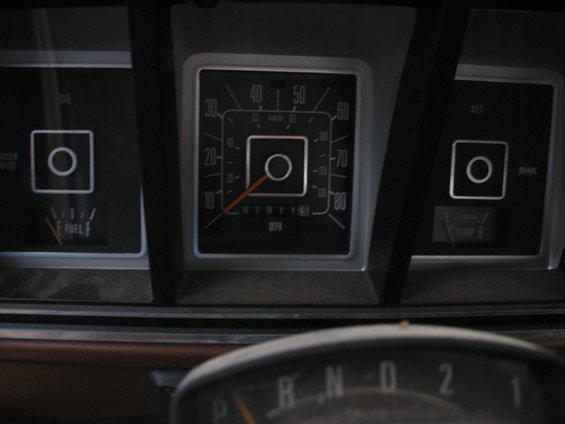 1978 Ford F-250 dashboard with speedometer, fuel gauge, oil pressure light, and temperature gauge