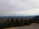 2008 Honda RANCHER - A scenic overlook shows a vast landscape of trees in fall colors stretching to the horizon.