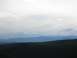2008 Honda RANCHER - A vast mountain range stretches across the horizon under a cloudy sky.