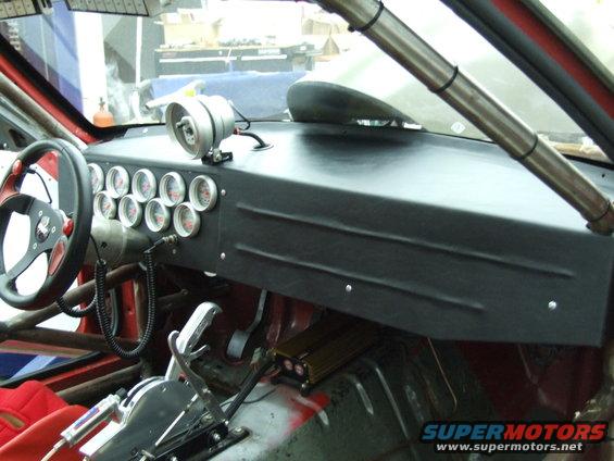 Interior with multiple gauges and racing steering wheel
