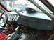 1990 Ford Mustang - The interior of a modified vehicle features a dashboard with numerous gauges and a racing steering wheel.