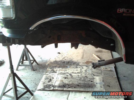 1996 Ford Bronco side view of frame and undercarriage on jack stands