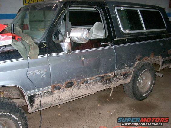 Side view of a rusty 1988 Chevrolet Blazer with "BLAZER" badge visible