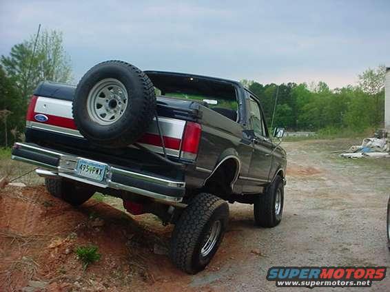 Black 1989 Ford Bronco rear 3/4 view with spare tire mounted