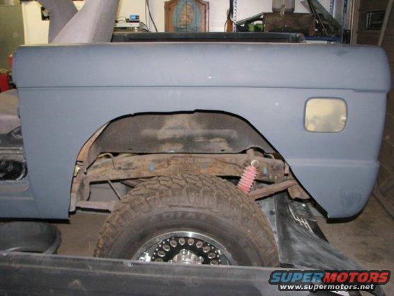 1976 Ford Bronco rear fender and wheel well, gray primer