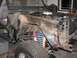 1976 Ford Bronco - This 1976 Ford Bronco is undergoing repairs, with its front end disassembled to reveal the engine and suspension components.