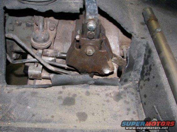 close-up of vehicle's manual transmission shift linkage and related components