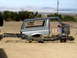 1996 Ford Bronco - The body and chassis of a 1996 Ford Bronco are shown separated in an outdoor setting.