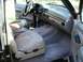 1994 Ford Bronco - Interior view of a 1994 Ford Bronco, tan leather seats and dashboard.