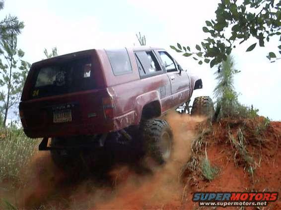 in a ravine, 90 degree turn to go over ledge to get back into the sand "playground"